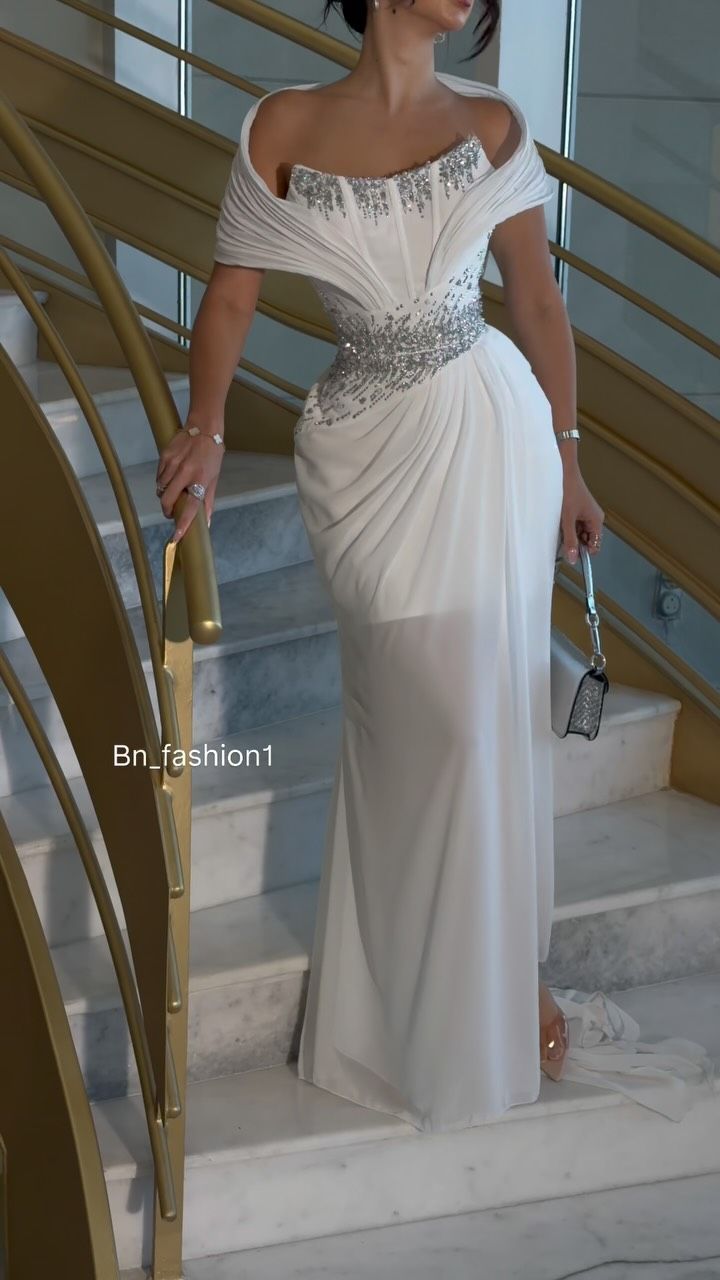 Off-shoulder draped beaded gown