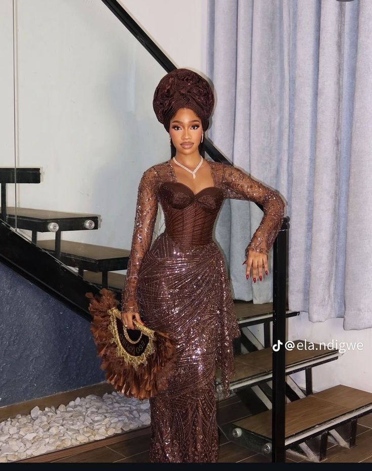 Brown beaded corset gown with gele