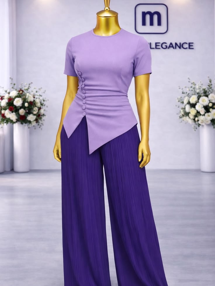 Lilac asymmetric button top with purple pleated trousers