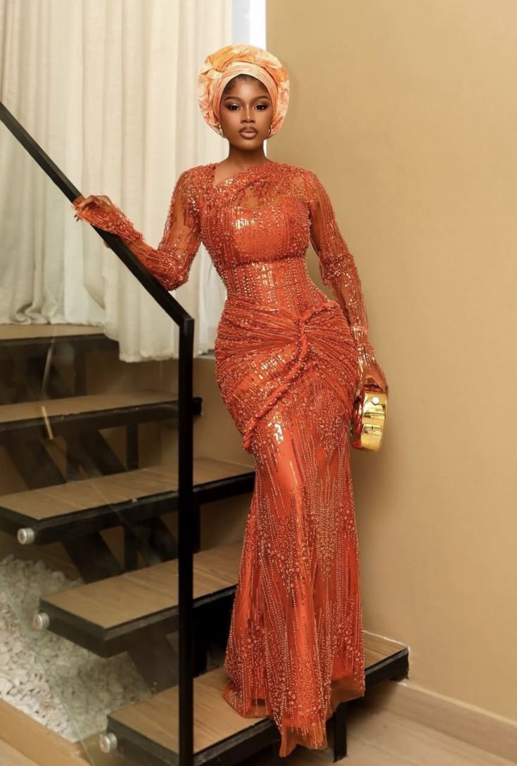 Burnt orange beaded long-sleeve gown